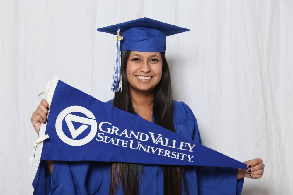 A future alumna poses with the GV flag at Gradfest